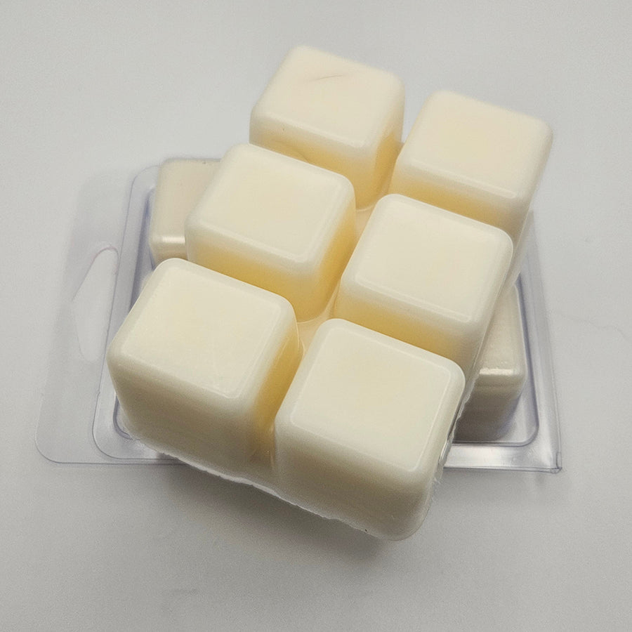 A set of wax melts in a clamshell on a white background. The pictured scent is Knives.