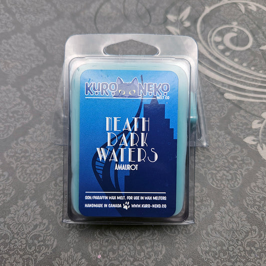 A set of wax melts in a clamshell on a dark grey patterned background. The pictured scent is Neath Dark Waters: Amaurot.