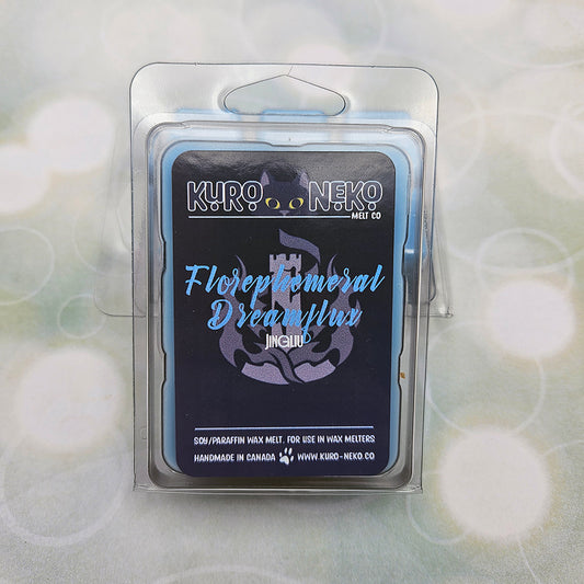 A set of wax melts in a clamshell on a light green background with circles. The pictured scent is Florephemeral Dreamflux: Jingliu.