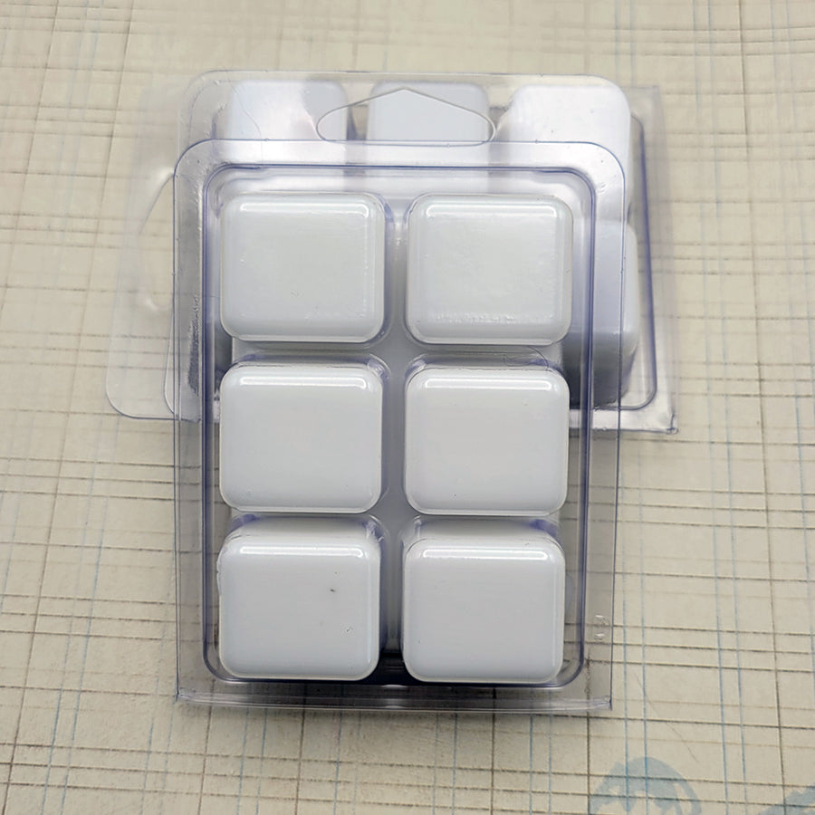 A set of wax melts in a clamshell on a pale grid background. The pictured scent is 8 Down.